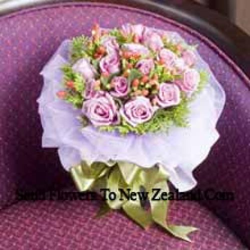 11 Light Pink Wrapped Roses