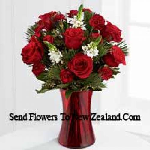 Roses and Assorted Greenery in Red Vase